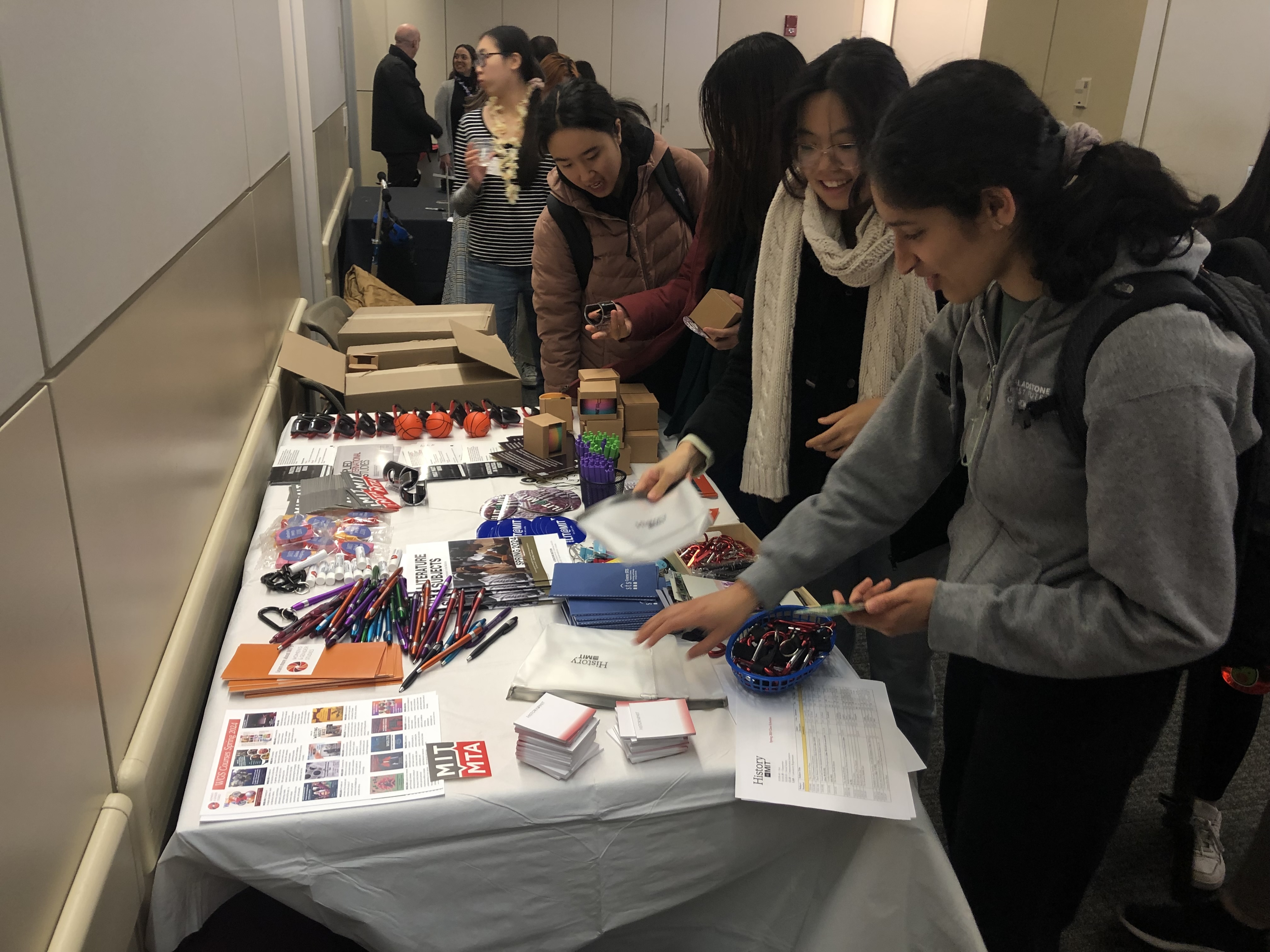 Students select swag during the Spring Ahead with SHASS event