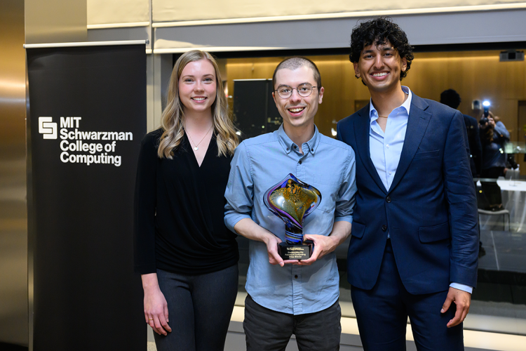 Christopher Maynard with runners ups, Sadie Zacharek (far left), a PhD candidate in the Department of Brain and Cognitive Sciences, and Siddhu Pachipala (far right), an undergraduate majoring in economics and political science.