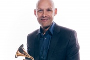MIT Music and Theater Arts Assistant Professor Miguel Zenón holds his Grammy Award for Best Latin Jazz Album. 