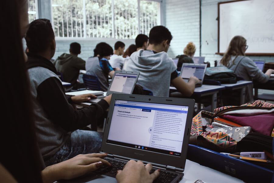 An image of people at computers in a classroom