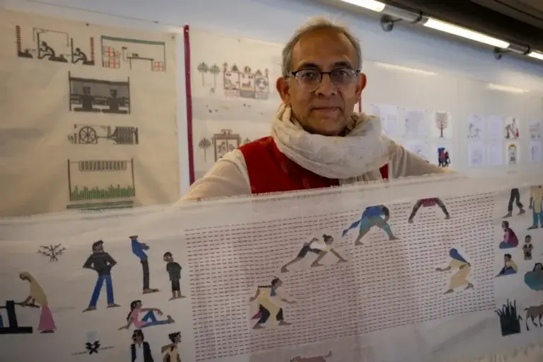Abhijit Banerjee holding a muslin