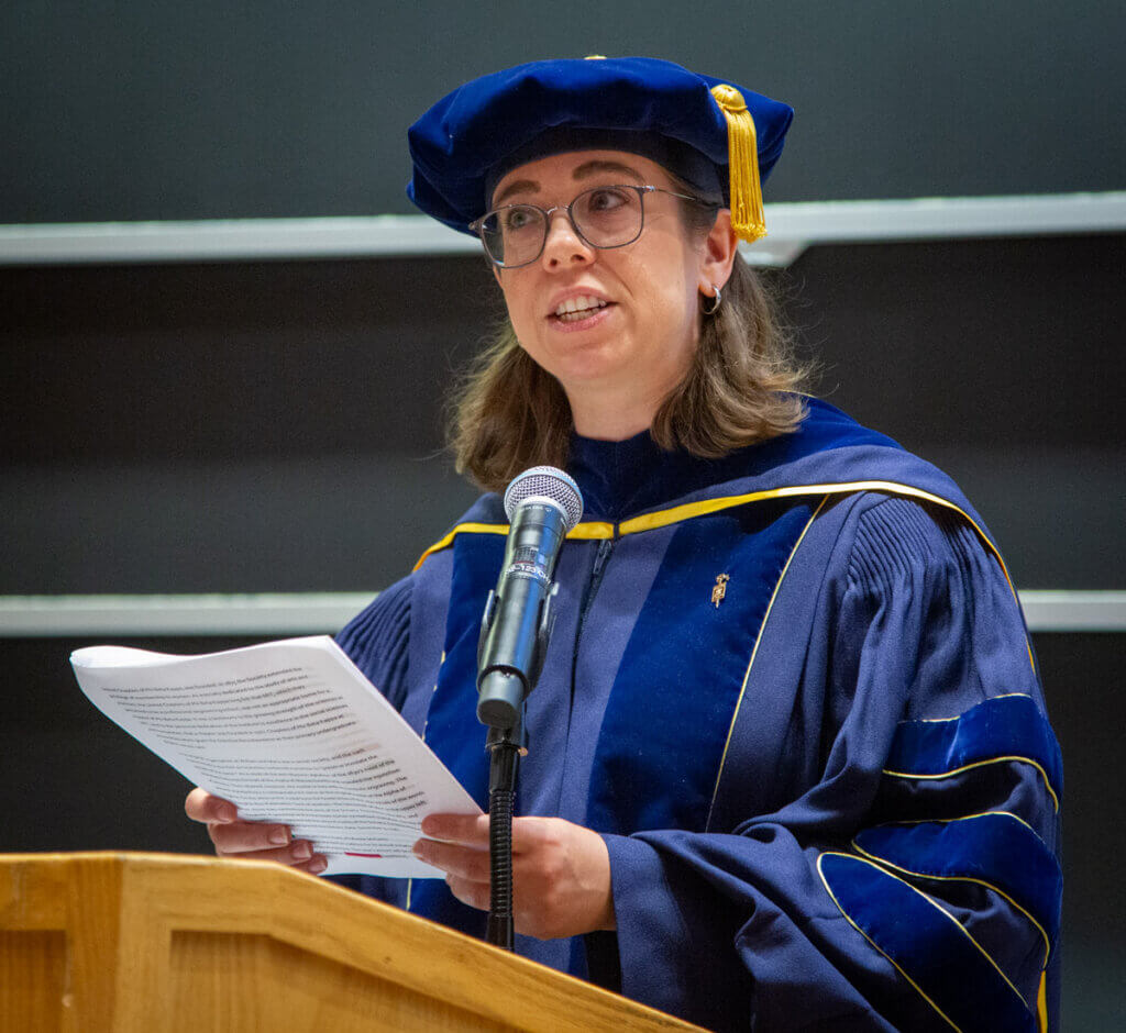 Emily Richmond Pollock, Associate Professor of Music and President of Xi of Massachusetts, welcomes students and their families to the Phi Beta Kappa Induction Ceremony